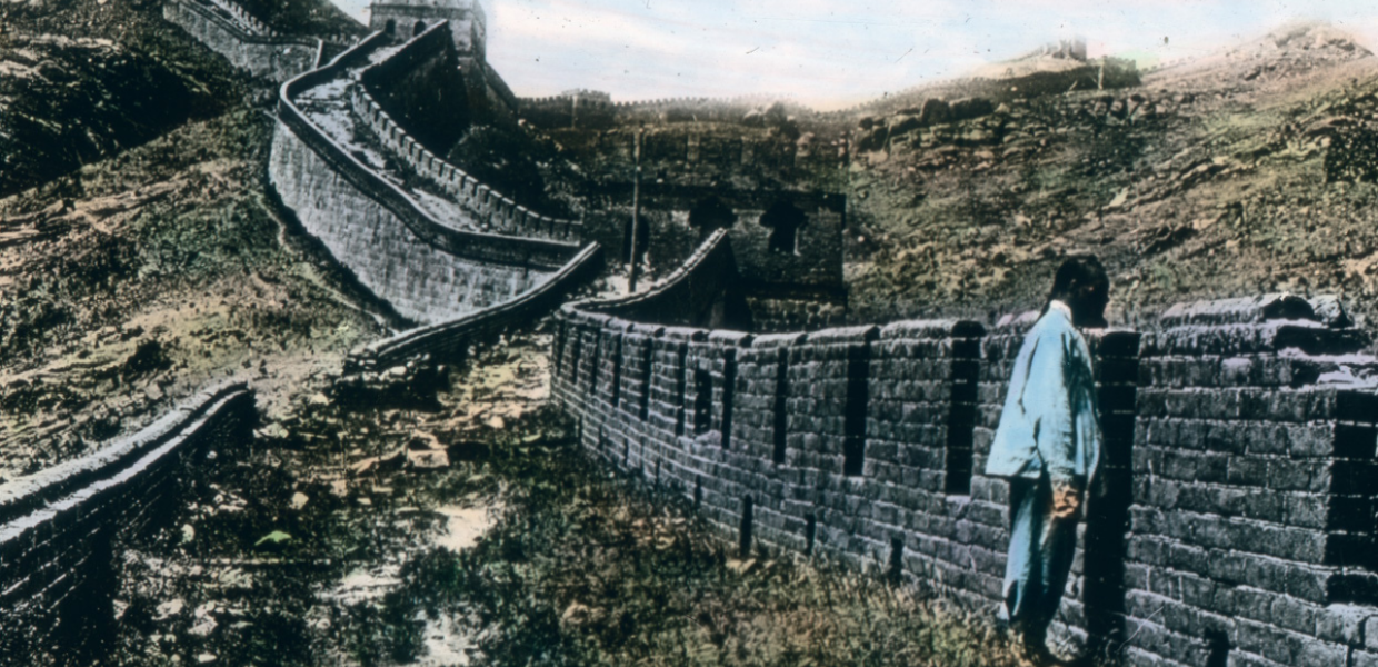 A man looks over the Great Wall of China